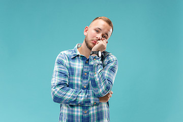 Image showing Beautiful bored man bored isolated on blue background