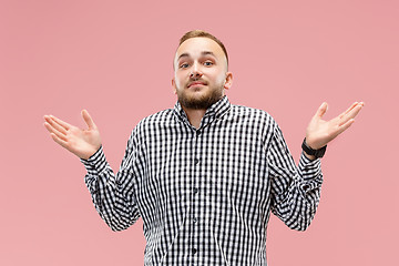 Image showing Beautiful male half-length portrait isolated on pink studio backgroud.