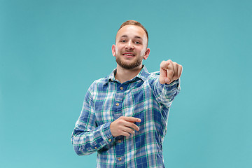 Image showing The happy business man point you and want you, half length closeup portrait on pink background.