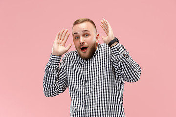 Image showing Portrait of the scared man on pink