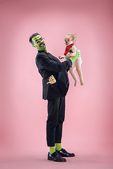 Image showing Halloween Family. Happy Father and Children Girl in Halloween Costume and Makeup