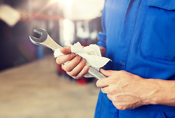 Image showing auto mechanic or smith with wrench at car workshop