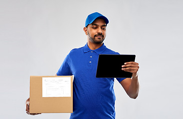 Image showing indian delivery man with tablet pc and parcel box