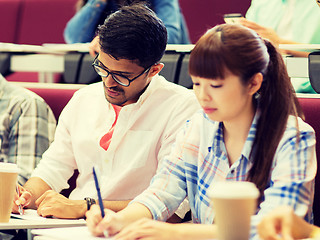 Image showing group of students with coffee writing on lecture