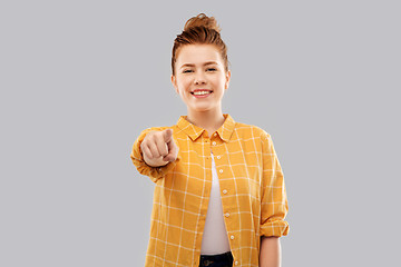 Image showing smiling red haired teenage girl in checkered shirt