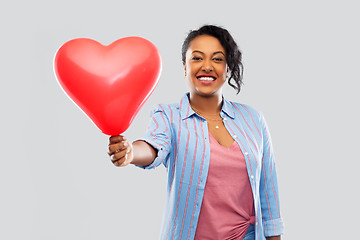 Image showing african american woman with heart-shaped balloon