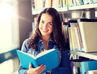 Image showing high school student girl reading book at library