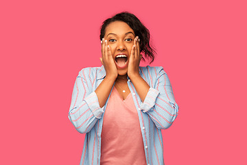 Image showing happy african american woman over pink background