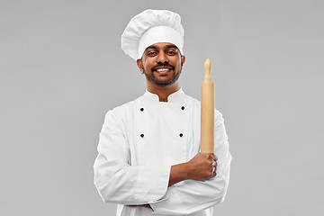 Image showing happy male indian chef or baker with rolling-pin