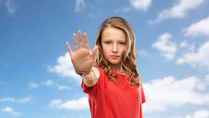 Image showing serious teenage girl showing stop gesture