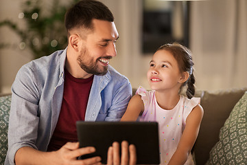 Image showing father and daughter with tablet computer at home