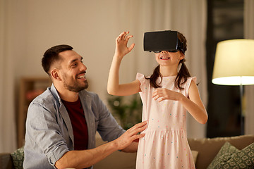 Image showing father and daughter in vr glasses playing at home