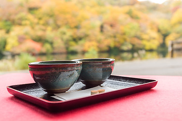 Image showing Japanese green tea with autumn background