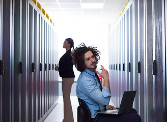 Image showing technicians working together on servers