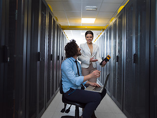 Image showing technicians working together on servers