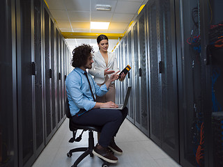 Image showing technicians working together on servers
