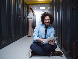 Image showing young technicians working together on servers