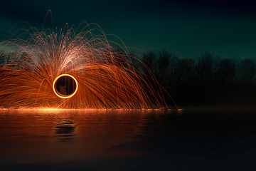 Image showing steel wool firework at night at the lake