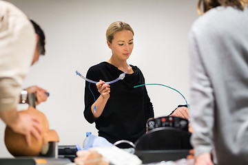 Image showing Medical doctor specialist expert displaying method of patient intubation technique on hands on medical education training and workshop