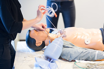 Image showing Medical doctor specialist expert displaying method of patient intubation technique on hands on medical education training and workshop