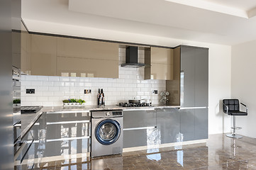 Image showing Luxury modern white, beige and grey kitchen interior