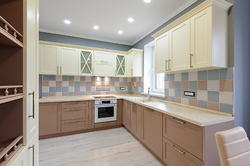 Image showing Luxury modern provence styled grey, pink and cream kitchen interior