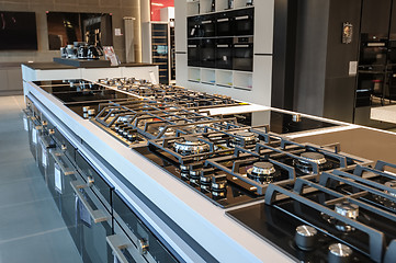 Image showing Brand new gas stoves in apliance store showroom