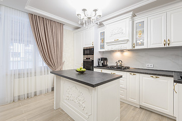 Image showing White luxury modern kitchen with island