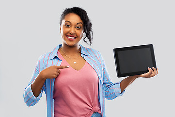 Image showing happy african american woman showing tablet pc