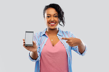 Image showing happy african american woman showing smartphone