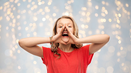 Image showing happy teenage girl in red t-shirt shouting