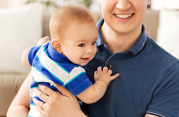 Image showing happy baby son with father at home