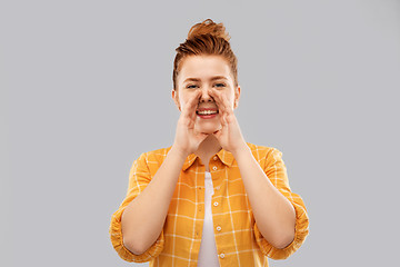 Image showing happy red haired teenage girl calling someone