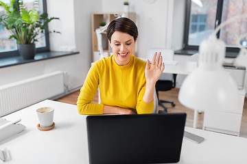 Image showing businesswoman having video call at office