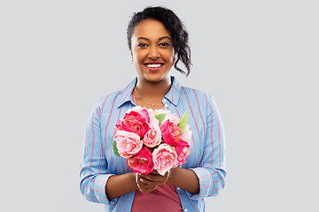 Image showing happy african american woman with bunch of flowers