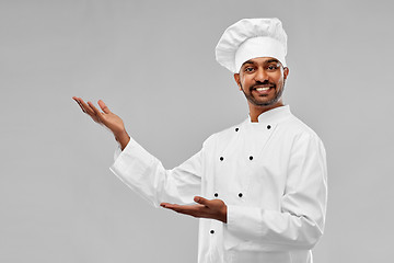 Image showing happy male indian chef in toque