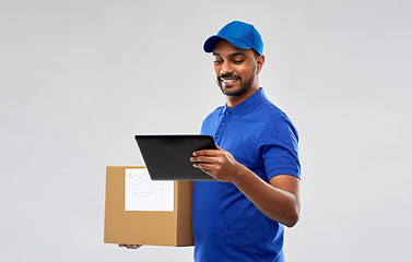 Image showing indian delivery man with tablet pc and parcel box