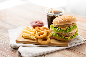 Image showing close up of fast food and cola drink on table