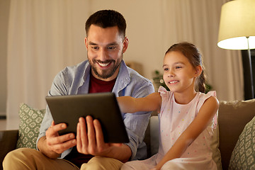 Image showing father and daughter with tablet computer at home