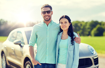 Image showing happy man and woman hugging at car