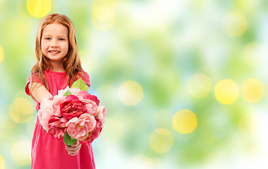 Image showing happy red haired girl with flowers