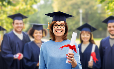 Image showing happy senior graduate student woman with diploma