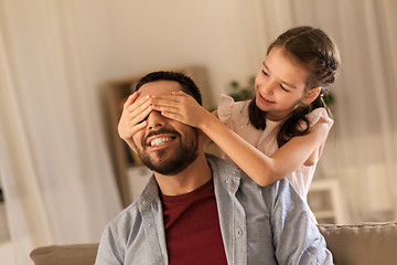 Image showing happy father and little daughter playing at home