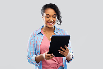 Image showing happy african american woman using tablet pc