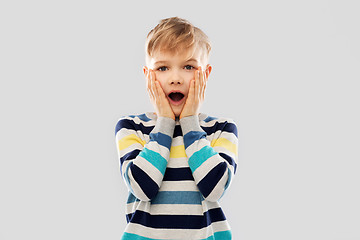 Image showing shocked little boy in striped pullover