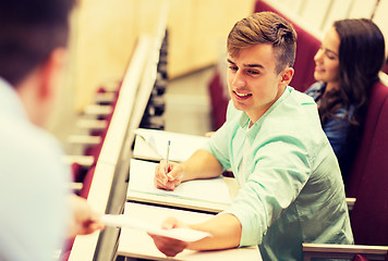 Image showing teacher giving test to student boy on lecture