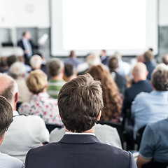 Image showing Business speaker giving a talk at business conference event.