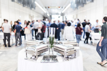 Image showing Blured image of businesspeople at coffee break at conference meeting.