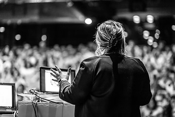 Image showing Public speaker giving talk at Business Event.