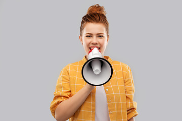 Image showing red haired teenage girl speaking to megaphone